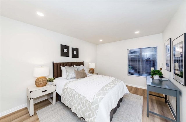 bedroom with light hardwood / wood-style flooring