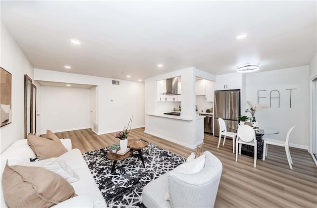 living room featuring light hardwood / wood-style floors