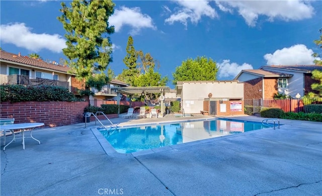 view of pool featuring a pergola and a patio