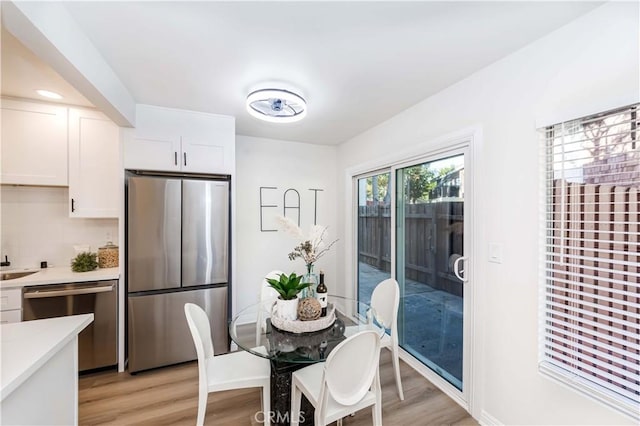 dining room with light hardwood / wood-style floors