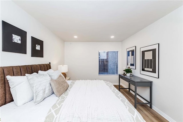 bedroom with hardwood / wood-style floors