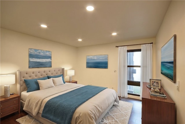 bedroom with dark wood-type flooring