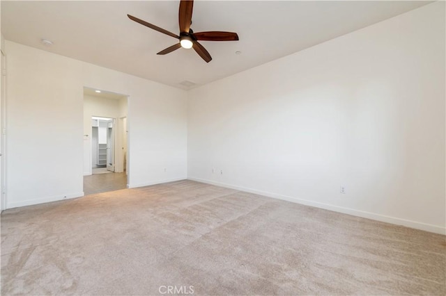 empty room with light carpet and ceiling fan