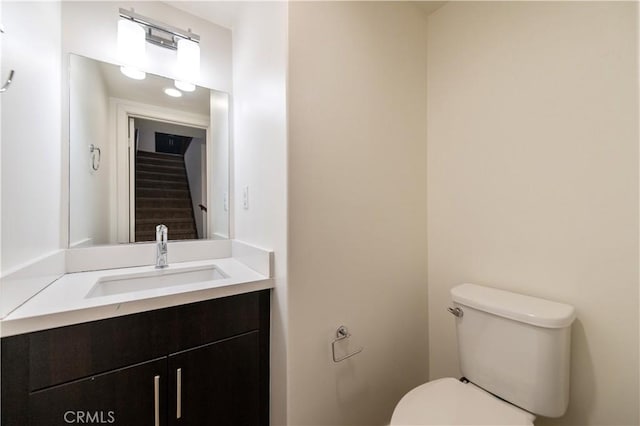 bathroom with toilet and vanity