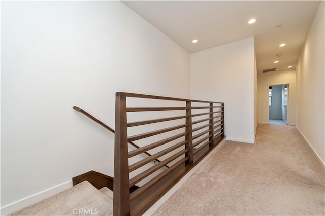 hallway with light carpet