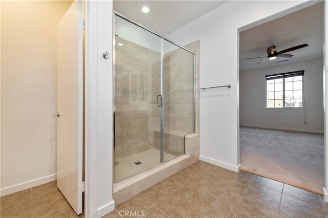 bathroom with ceiling fan, tile patterned floors, and walk in shower