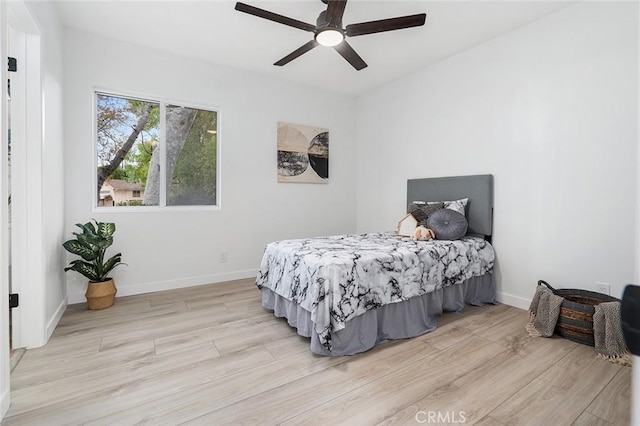 bedroom featuring ceiling fan and light hardwood / wood-style flooring