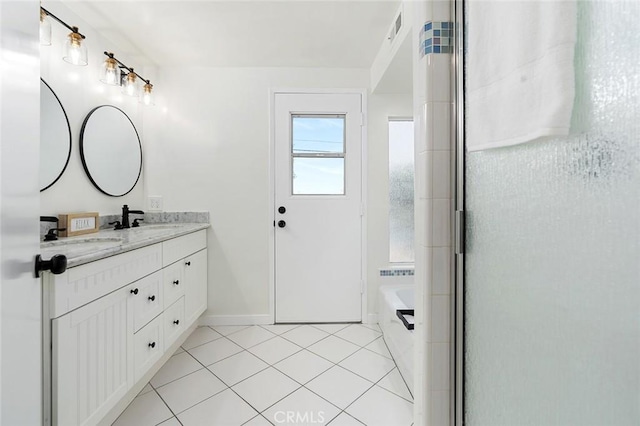 bathroom featuring plus walk in shower, tile patterned floors, and vanity