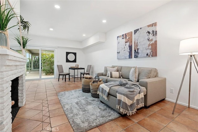 living room featuring tile patterned floors and a fireplace