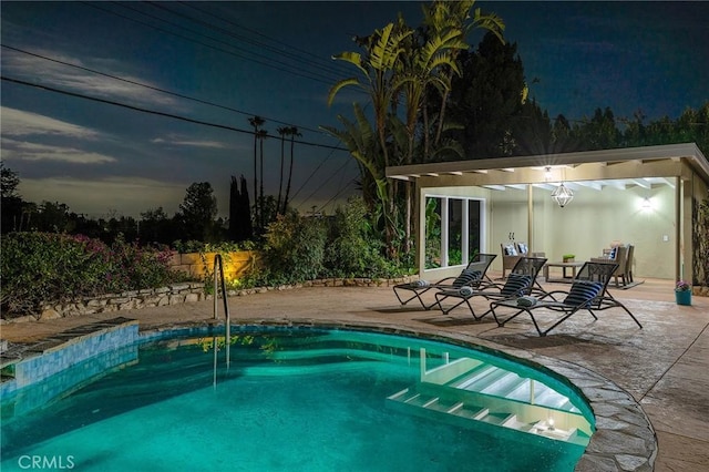 view of swimming pool with a patio area