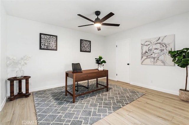 office area with hardwood / wood-style flooring and ceiling fan