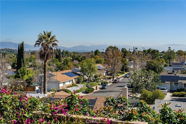 birds eye view of property with a mountain view