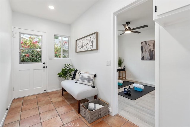 interior space featuring ceiling fan and light tile patterned floors