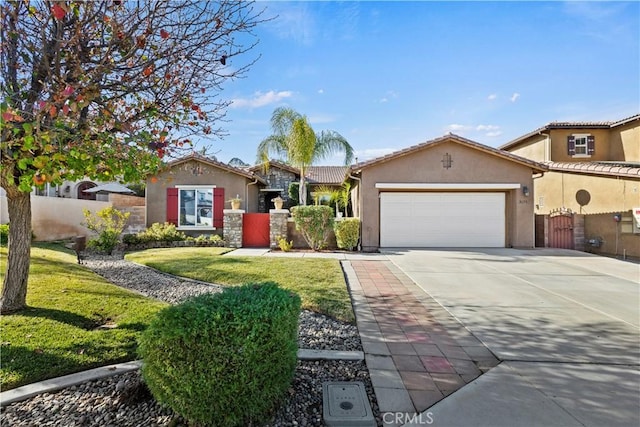 view of front facade with a front yard and a garage