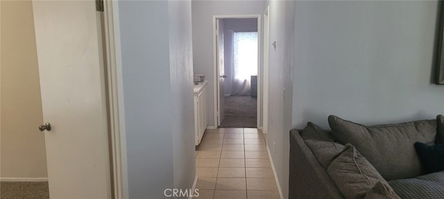 hallway with light tile patterned flooring