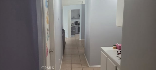 interior space featuring tile patterned floors and decorative backsplash