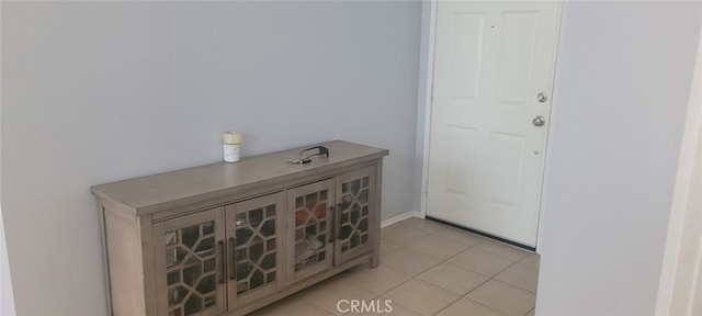 foyer with light tile patterned floors