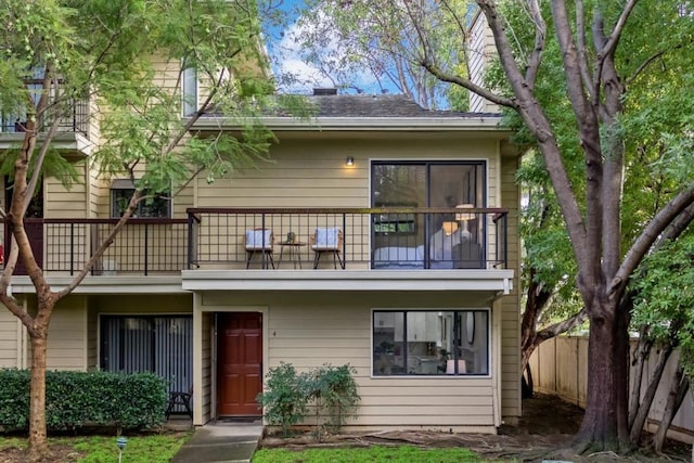 view of front of property with a balcony