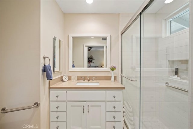 bathroom featuring vanity and walk in shower