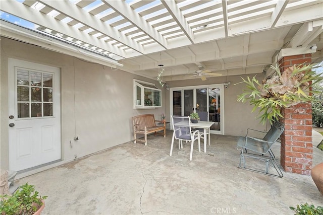 view of patio / terrace featuring ceiling fan and a pergola