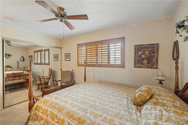 bedroom with multiple windows, a closet, ceiling fan, and carpet floors