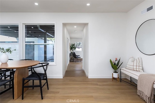 dining area featuring light wood-type flooring