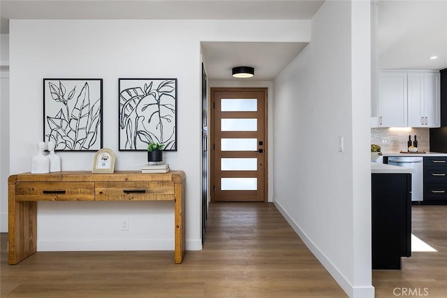 foyer entrance featuring hardwood / wood-style flooring