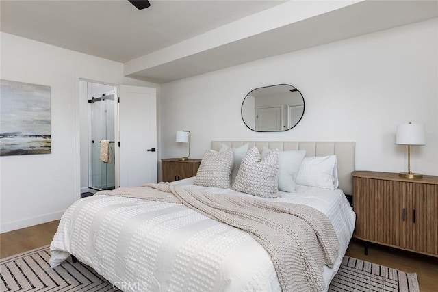 bedroom featuring ceiling fan and dark wood-type flooring