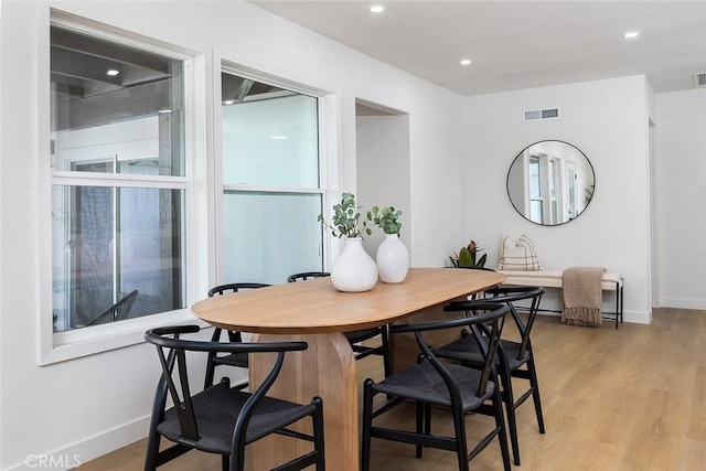 dining space featuring light hardwood / wood-style floors