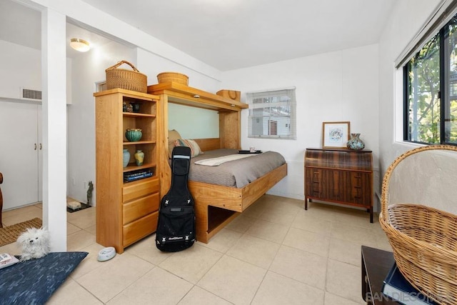 bedroom with light tile patterned floors