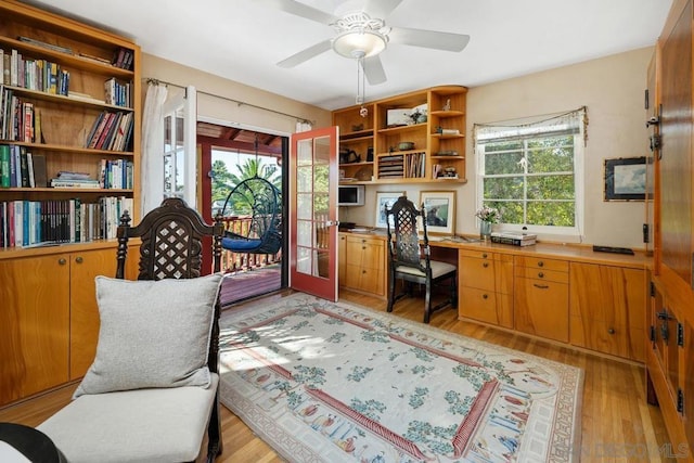 office area with ceiling fan, light wood-type flooring, and french doors