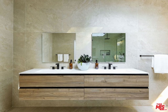 bathroom featuring tile walls and vanity