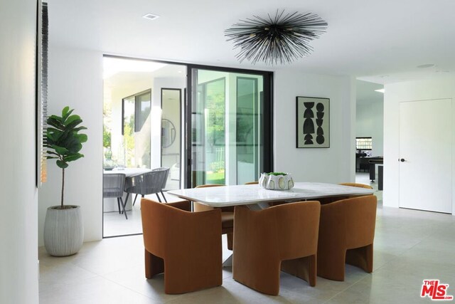 dining area featuring floor to ceiling windows