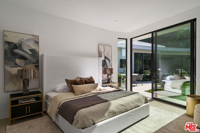 bedroom featuring access to outside