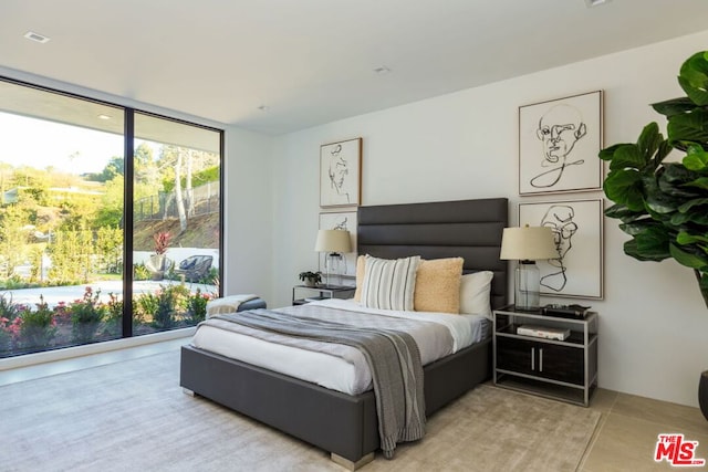 bedroom featuring expansive windows