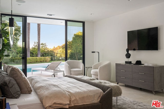 tiled bedroom featuring a wall of windows and access to outside