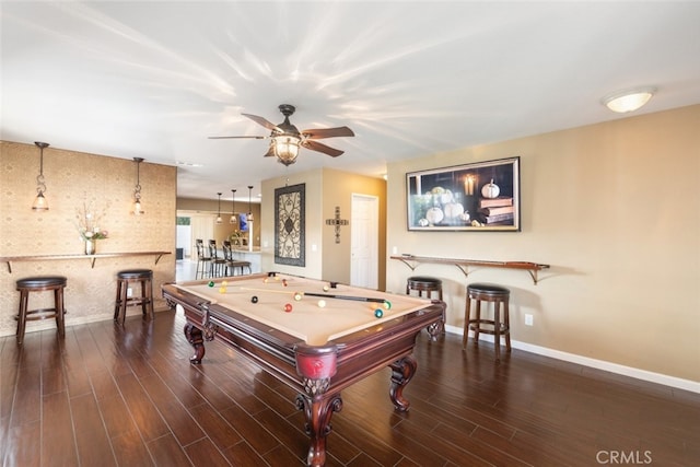 recreation room featuring ceiling fan, billiards, bar, and dark hardwood / wood-style floors