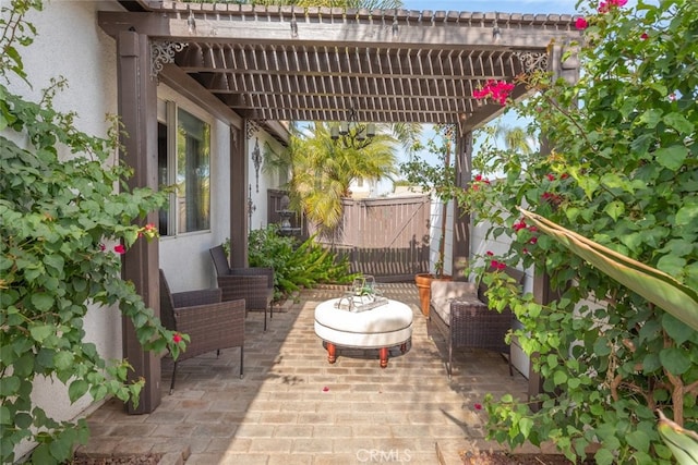 view of patio with outdoor lounge area and a pergola