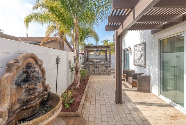 view of patio with a pergola and an outdoor bar