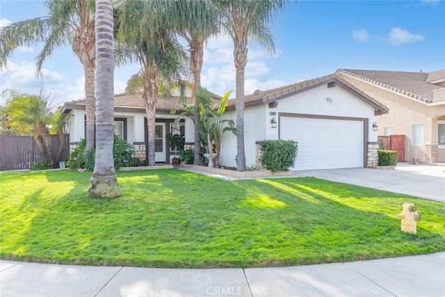 view of front of home featuring a garage and a front lawn