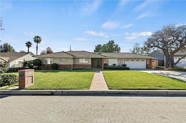 ranch-style house featuring a front yard and a garage