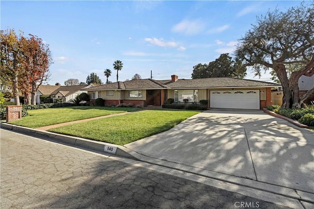 single story home featuring a front yard and a garage