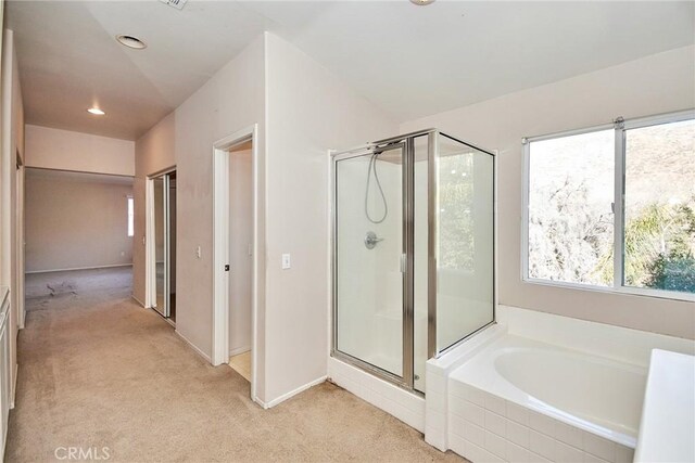 bathroom featuring plus walk in shower