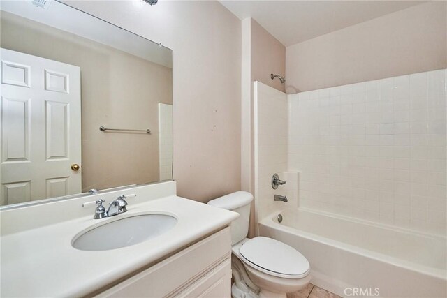 full bathroom with toilet, vanity, tile patterned floors, and tub / shower combination