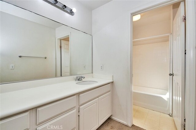 bathroom featuring vanity and  shower combination