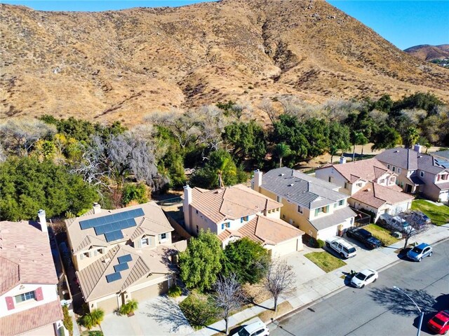 birds eye view of property featuring a mountain view