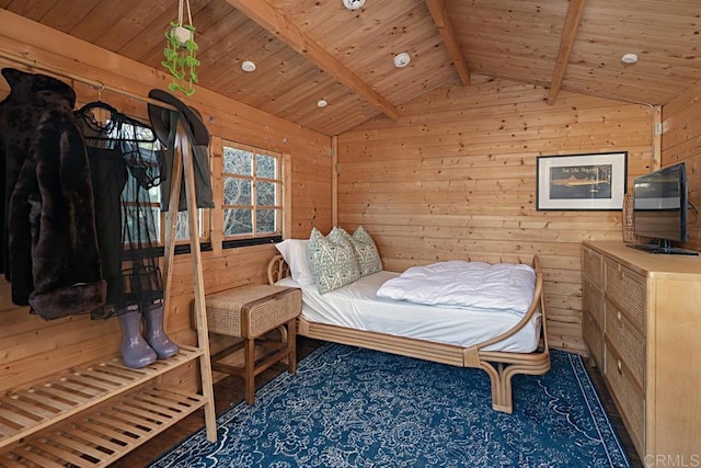 bedroom with wood walls, lofted ceiling with beams, and wood ceiling