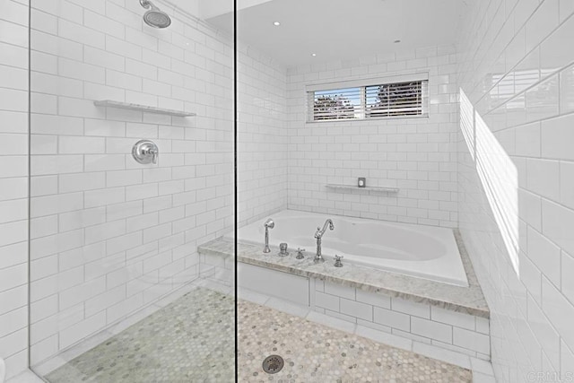 bathroom featuring tile patterned flooring and independent shower and bath