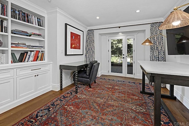 home office featuring ornamental molding, dark hardwood / wood-style flooring, french doors, and built in shelves