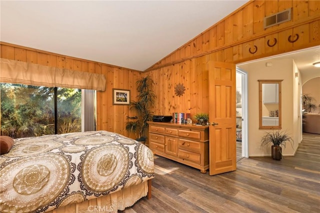 bedroom featuring vaulted ceiling and dark hardwood / wood-style floors